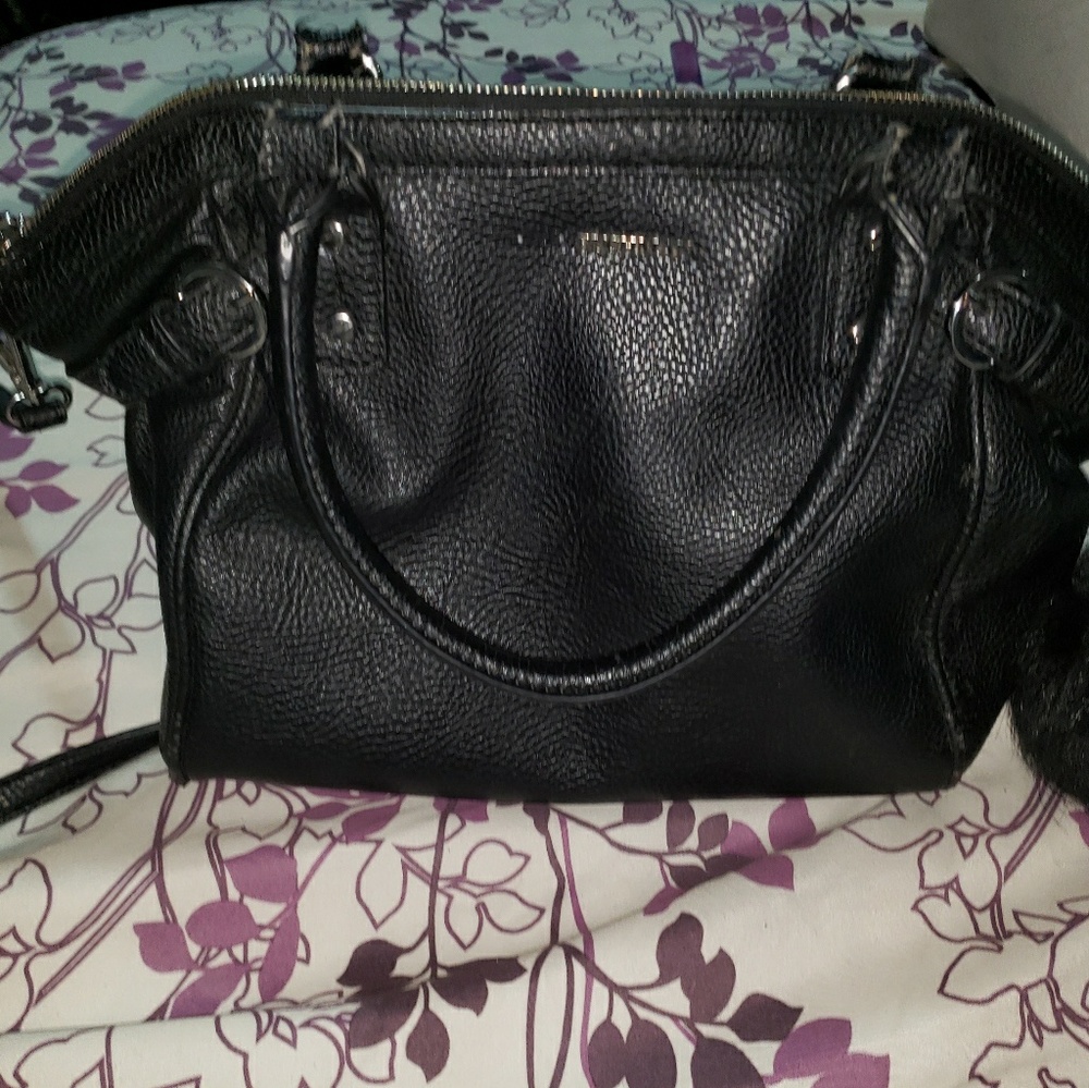 Used in great condition Buchman black purse